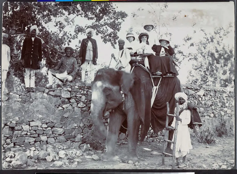 Etta_Cone_and_Claribel_Cone_seated_on_an_elephant_with_Moses_and_Bertha_Cone_India.jpg