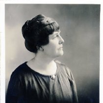 Lucy Gwynne Fisher Branham, mother of Lucy Fisher, profile photo. She has short brown hair.