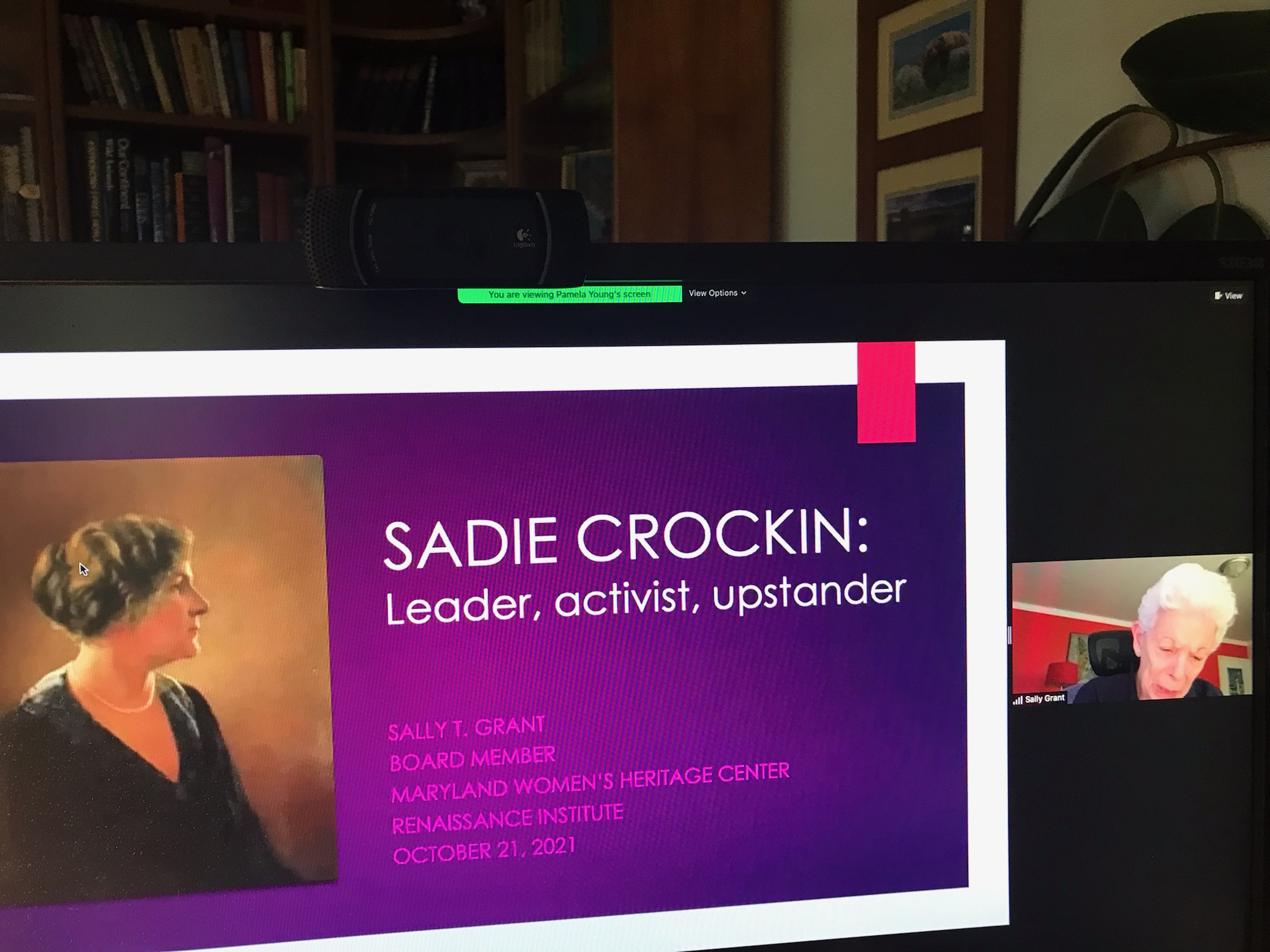 a photo of a virtual presentation on a computer monitor. the presented is in the background