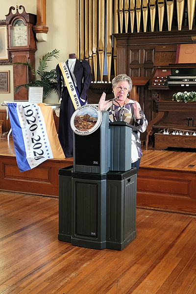diana Bailey at lectern in Howard Historical Society museum