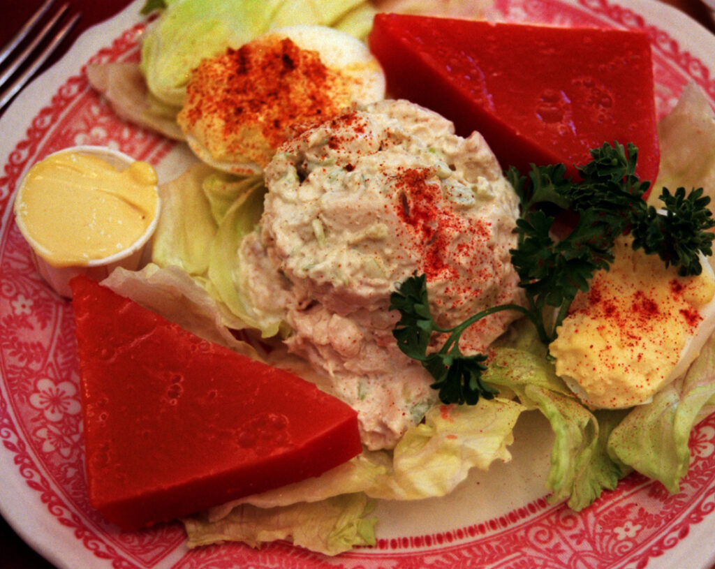 Tomato aspic and chicken salad on a plate