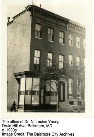 Historic photo of a three story corner office with windows in Baltimore which was Dr. Youngs office