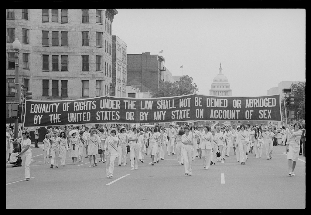 1970s era photo of a ERA parade with Capitol in the background