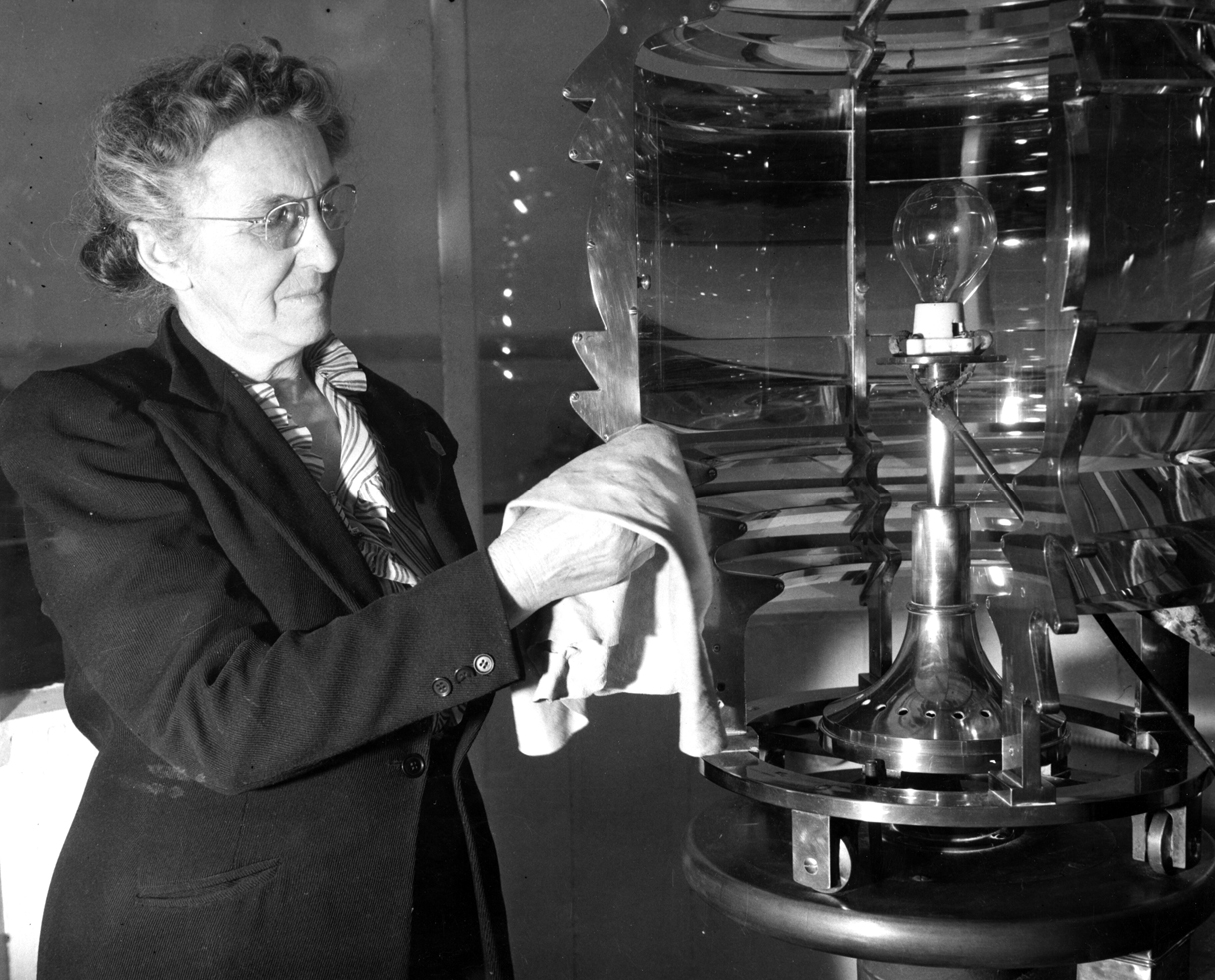 Fannie Mae Salter A black & White photo of Fannie Mae Salter cleaning the lens on a lighthouse lamp<br />