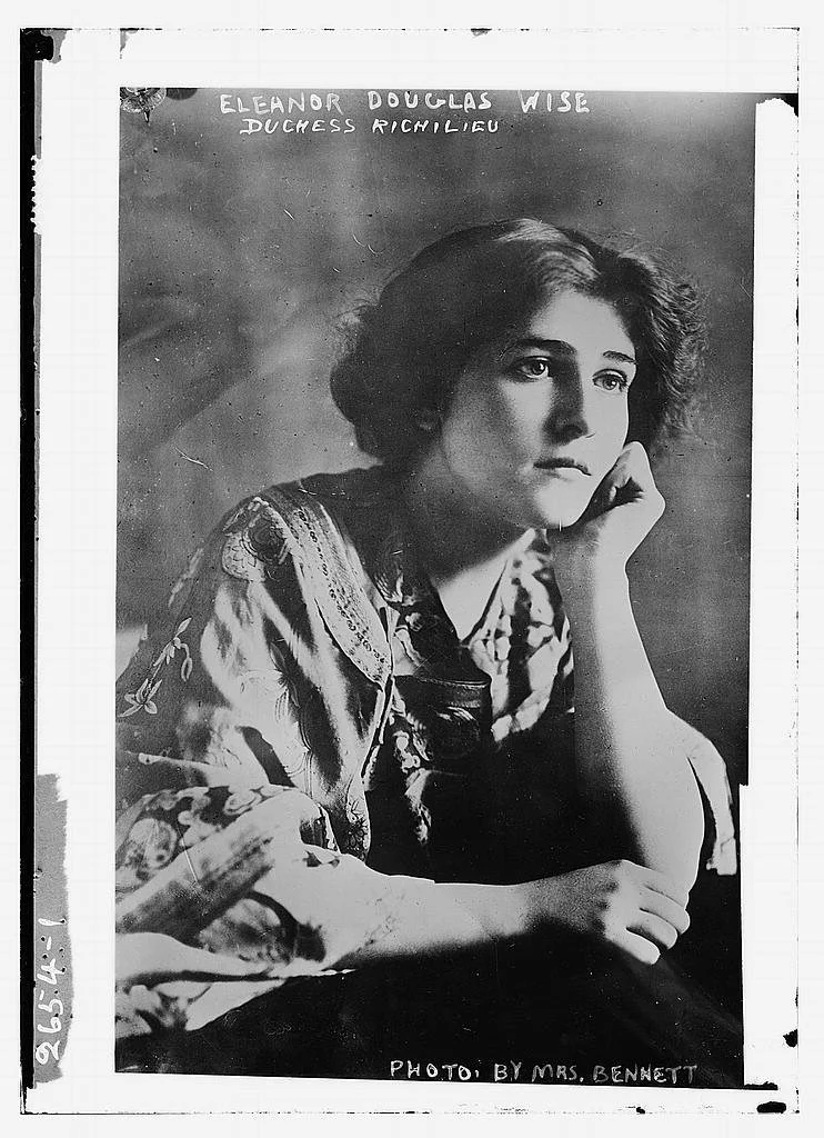 1920s era photo of Elinor wise, chin on hand