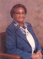 Harriet Brown about mid-50s, head shot. Wearing a blue suit