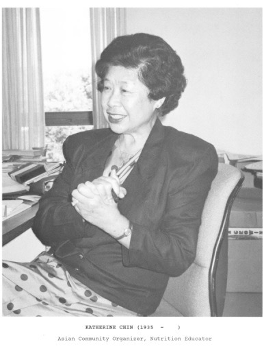 A black and white photo of Mrs. Chin sitting in a chair wearing a black jacket; likely aged 50s