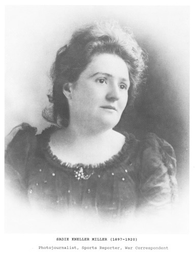 portrait of Sadie Miller, hari in upsweep, black dress with puff short sleeves
