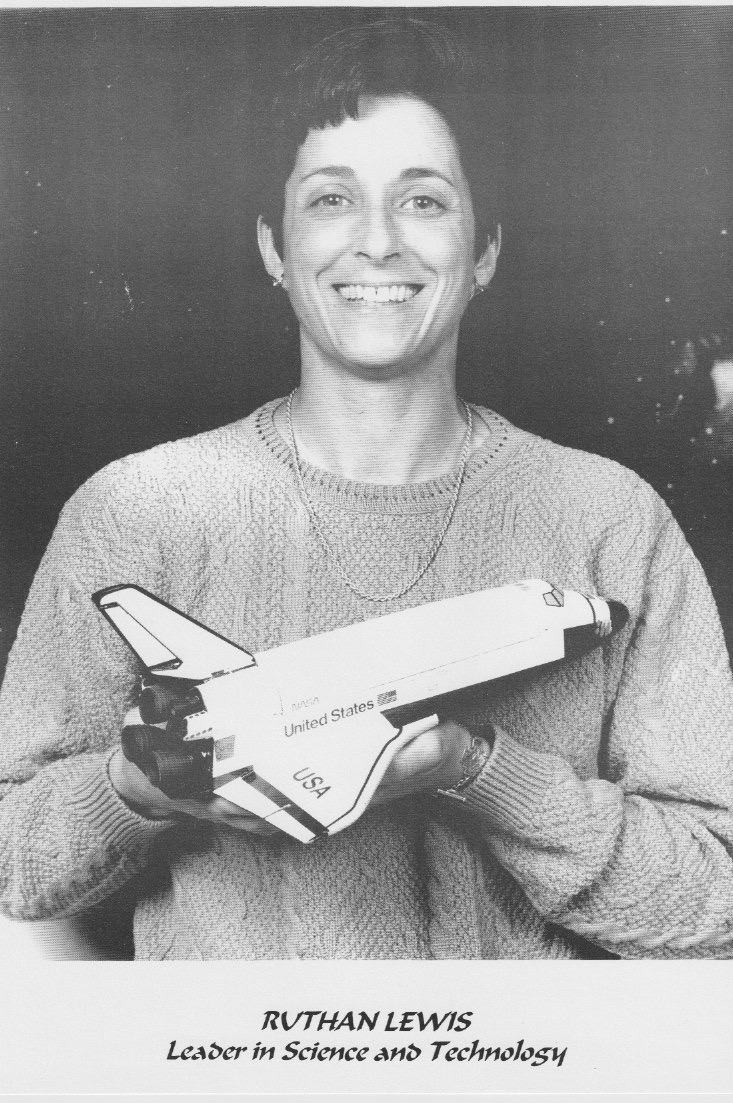 Black and White photo of dr. Ruthan Lewis, probably aged 30s, holding a replica of the space shuttle